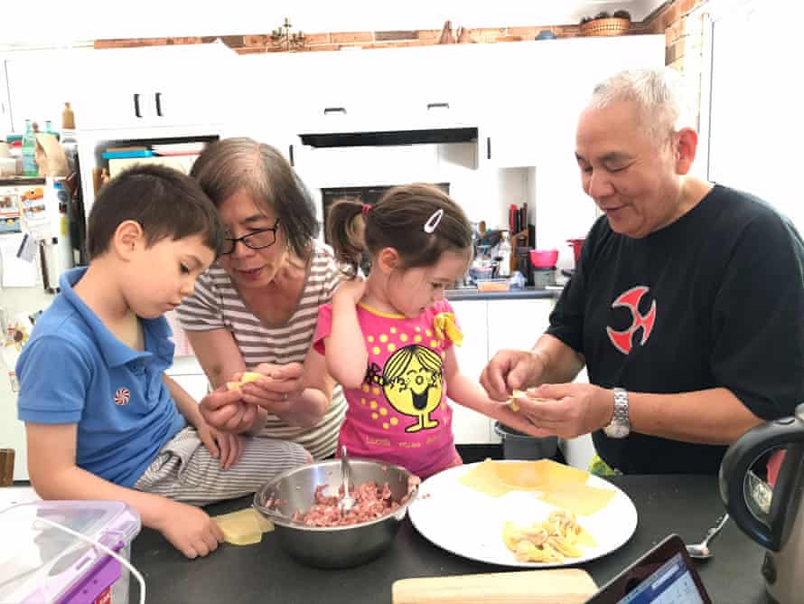 Katrina’s children cooking with their grandparents.