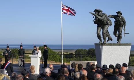 Theresa May speaks at a D-day ceremony in Normandy, France