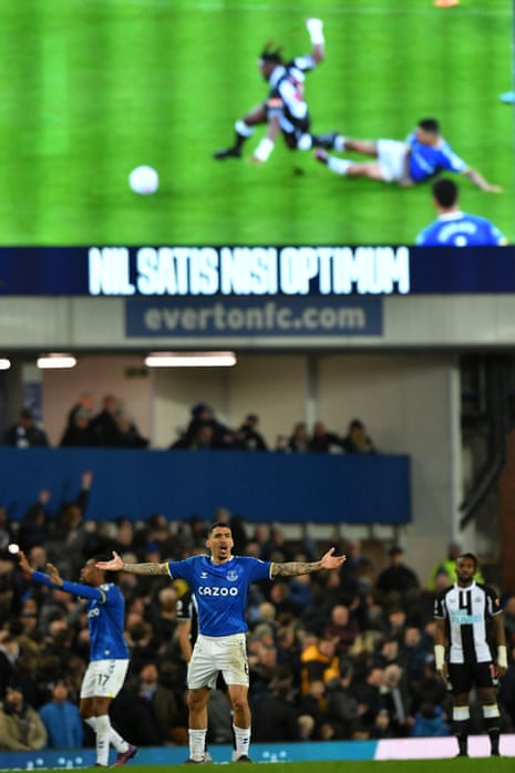 Everton’s Allan (centre) reacts after his challenge on Newcastle United’s Allan Saint-Maximin is shown on the big screen.