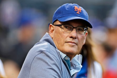 A man in a NY Mets cap