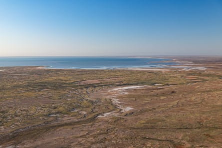 The south-west shore of Lake Eyre appears on the horizon