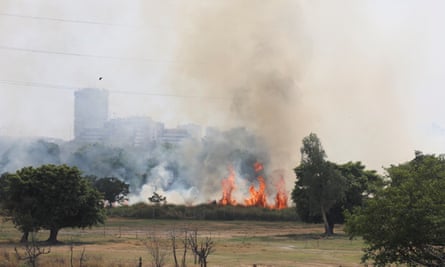 Smoke and flames in a field