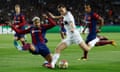 Barcelona's Ronald Araujo in action with Paris St Germain's Fabian Ruiz 