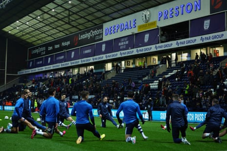 The players of Preston North End warm up ahead of kick-off.