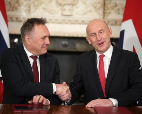 Norway’s Minister of Defence Tore O. Sandvik (L) and Britain’s secretary of state for Defence John Healey (R) during the signing of a Strategic Defence Agreement at Downing Street.
