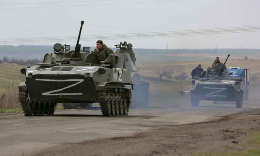 Russian military vehicles move on a highway in an area controlled by Russian-backed separatist forces near Mariupol, 18 April.