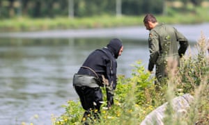 A diver next to a canal in Ronquieres during a search for evidence in the “Brabant’s killers” case