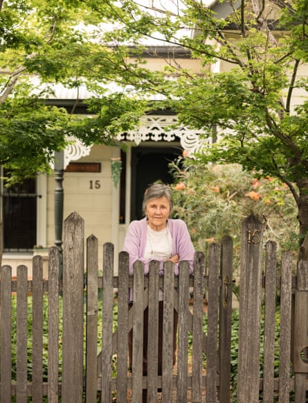 Garner stands in front of her garden gate at home in Melbourne.