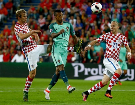 Ivan Strinic, left, catches Nani as he attempts to hook the ball clear.