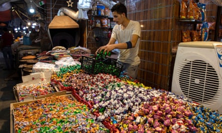 A stallholder selling sweets in Amman last week.