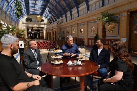 Keir Starmer (centre) meeting hospitality workers at the Mezzei Café in the Winter Gardens in Blackpool today.