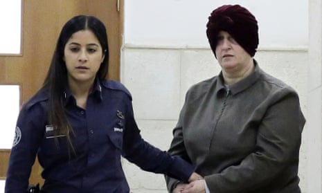 Malka Leifer, right, is brought to a courtroom in Jerusalem in 2018. 
