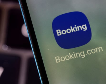Booking.com app is seen on a smartphone in this illustration