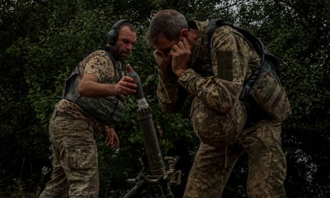 Ukrainian soldiers fire a mortar along the frontline in the Donetsk region.