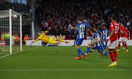 Nottingham Forest's Renan Lodi (right) shoots the ball that touches Brighton's Pascal Gross (no 13) and goes in the net for own goal and put Nottingham Forest level.