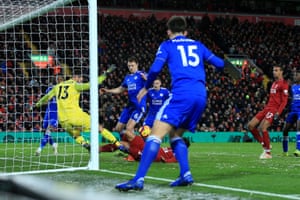 Alisson agrees with Firmino to clear the ball from the line.