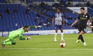 Manchester City’s Bernardo Silva, right, scores his side’s fourth goal.