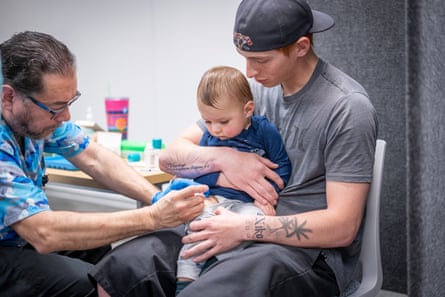A young boy being vaccinated.