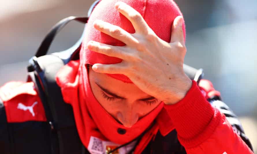 Charles Leclerc holds his head in frustration after his retirement