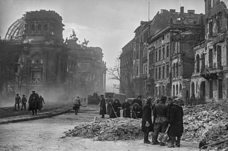 Cleaning the streets between the Reichstag and the Brandenburg Gate by the inhabitants of Berlin, Germany, May 1945