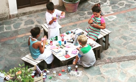 Isabel’s son paints tiles with the manager’s daughter, nephew and niece.