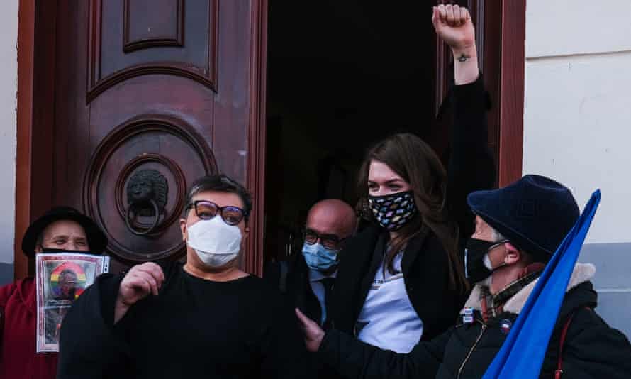 Anna Prus (second right) and Elżbieta Podleśna (second left) and their defence team celebrate  after the  ruling at Plock district court.