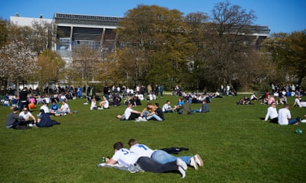 Fans relax before a match at the Parken Stadium.