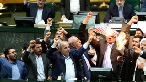Iranian lawmakers set paper US flag on fire – video