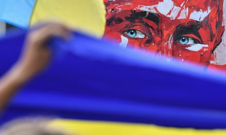 Ukrainian flag in front of image of Vladimir Putin