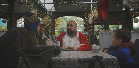 Asim Chaudhry as Santa with Ele McKenzie as and Lenny Rush as Chris.