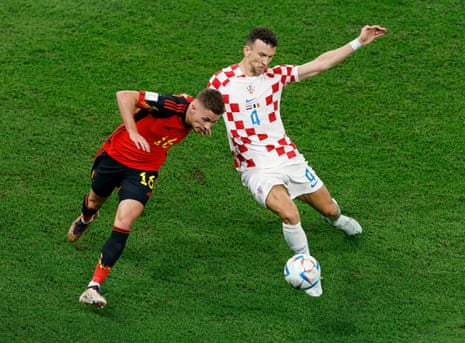 Thorgan Hazard battles for possession with the excellent Ivan Perisic.