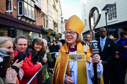 Sarah Mullally walks through the streets dressed in a golden cope and ceremonial headdress