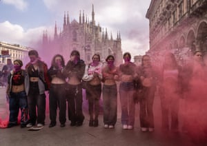 Milan, ItalyStudents and feminist activists wearing purple pañuelos congregate in Piazza del Duomo for a rally against patriarchy and violence