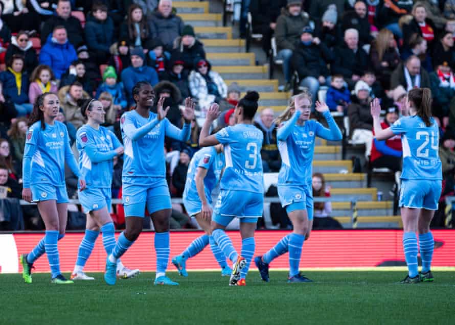 Khadija Shaw (centre) celebrates her fourth goal with her teammates.
