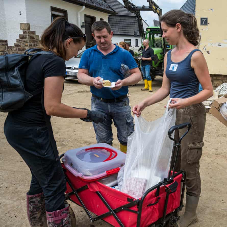 Helper distributes cake