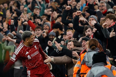 Liverpool's Ronald Araujo celebrates scoring their second goal with fans in the stands.