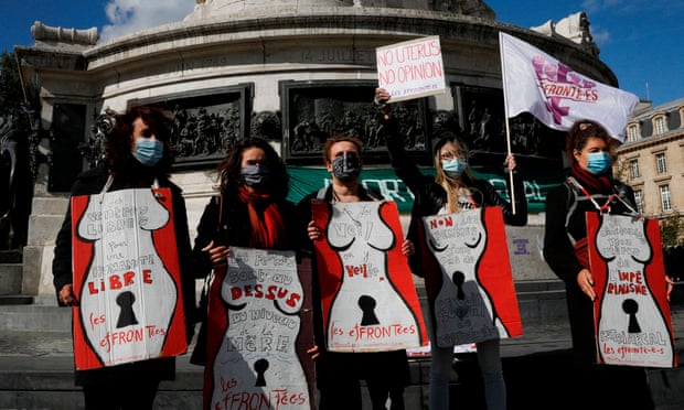 Pro-choice campaigners in Paris defend abortion rights.