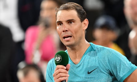 Rafael Nadal talks to the crowd while on court in Paris.