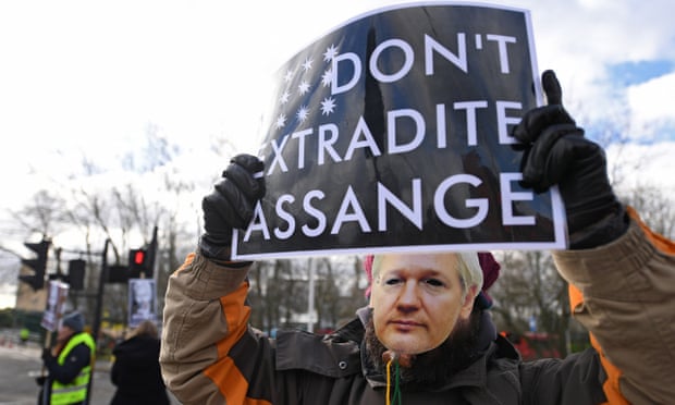 Julian Assange supporters protest outside Woolwich crown court in London.