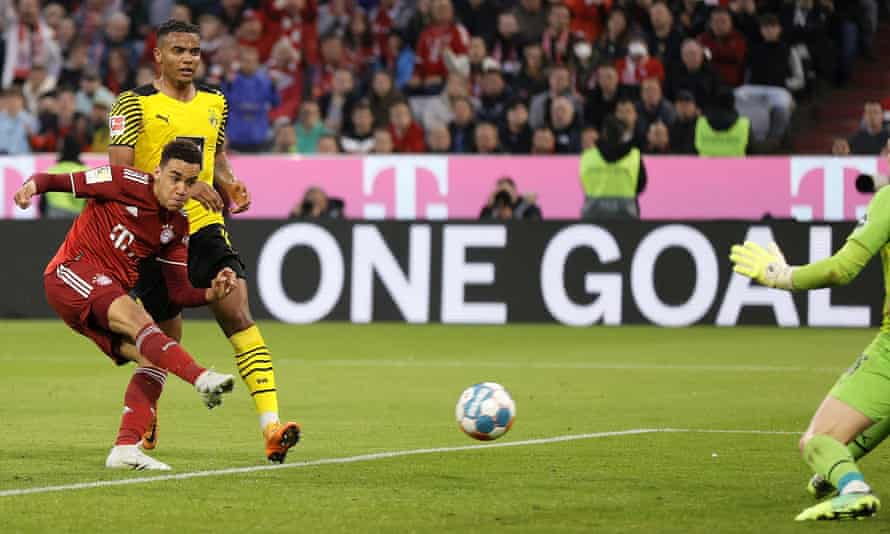 Bayern's Jamal Musiala fires home their third goal.