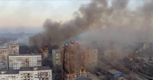 Smoke billows from high rise apartment buildings across the city.