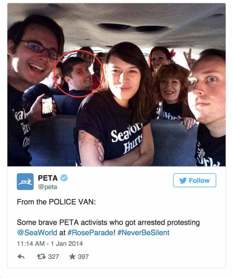 Thomas Jones, in the police van on the way to the Pasadena police station after being arrested while protesting the SeaWorld float at the Rose Parade.