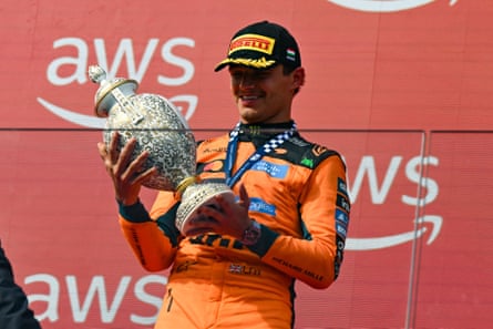 Lando Norris with his trophy after winning the Hungarian Grand Prix.