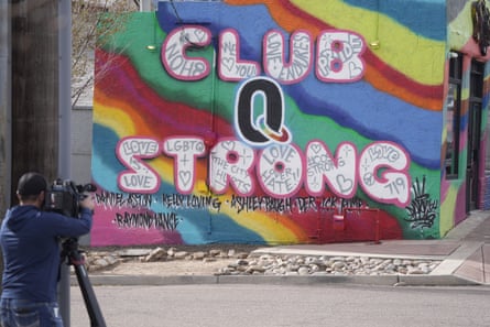 tv camera next to the wall with the words