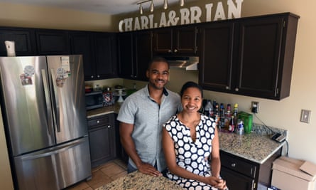 Brian and Charla Freeland stand inside their kitchen.