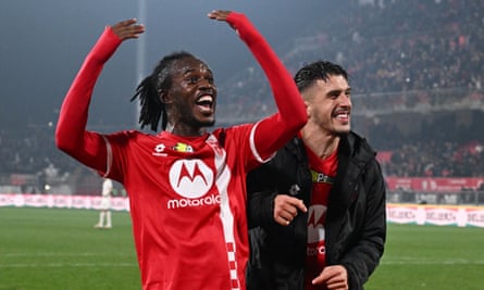 Monza’s Warren Bondo (left) celebrates scoring their third.