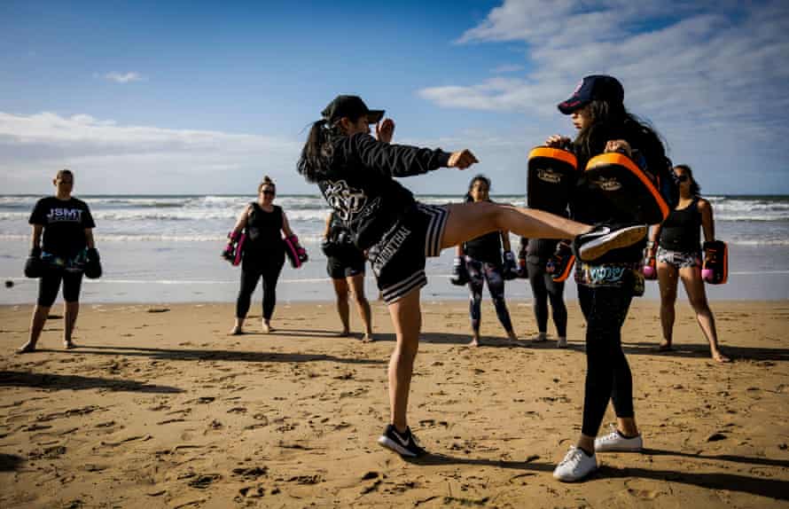 Jo and Som demonstrating exercises.