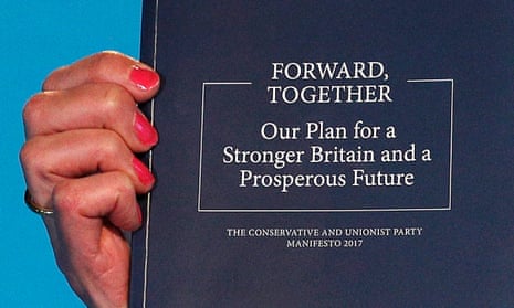 The Conservative party manifesto in 2017, held up by Theresa May.
