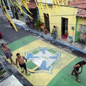 People paint the streets in Fortaleza in June 2014 for the World Cup, the day before Brazil played Mexico in the city.