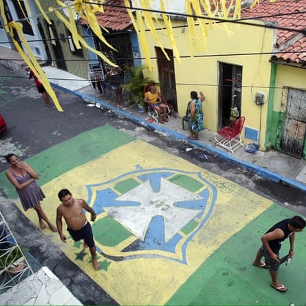 People paint the streets in Fortaleza in June 2014 for the World Cup, the day before Brazil played Mexico in the city.